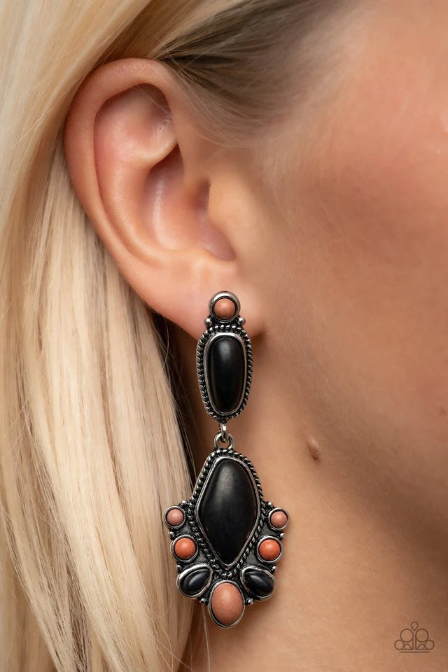 Paparazzi Accessories Terrestrial Talisman - Multi An oversized oval Fire Whirl cat's eye stone is pressed into a frilly silver backdrop whirling with studded filigree, resulting in a whimsical glow atop the finger. Features a stretchy band for a flexible
