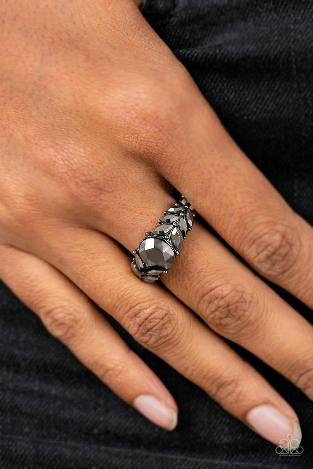 Paparazzi Accessories Smooth Smolder - Black Pairs of marquise cut hematite rhinestones fan out from an oversized hematite rhinestone, creating glitzy leafy accents across the front of a dainty and studded gunmetal band. Features a dainty stretchy band fo