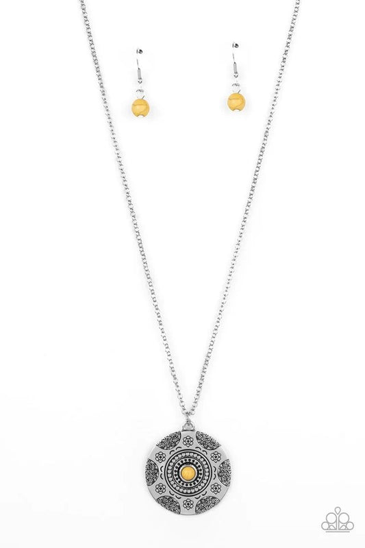 Paparazzi Accessories Wild Prairies - Yellow A dainty yellow stone is pressed into the center of a silver disc stamped in a whimsical floral motif, resulting in an earthy pop of color at the bottom of an extended silver chain. Features an adjustable clasp