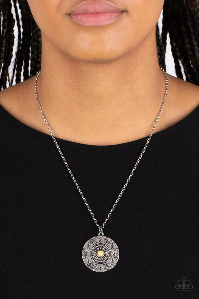 Paparazzi Accessories Wild Prairies - Yellow A dainty yellow stone is pressed into the center of a silver disc stamped in a whimsical floral motif, resulting in an earthy pop of color at the bottom of an extended silver chain. Features an adjustable clasp