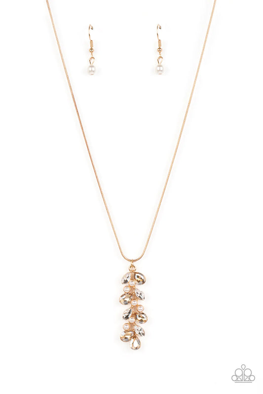 Paparazzi Accessories Pearls Before VINE - Gold Dainty faceted gold colored teardrops- and white marquise-cut gems climb around clusters of dainty white half-pearls, creating an elongated pendant that slides elegantly along a skinny gold snake chain. Feat