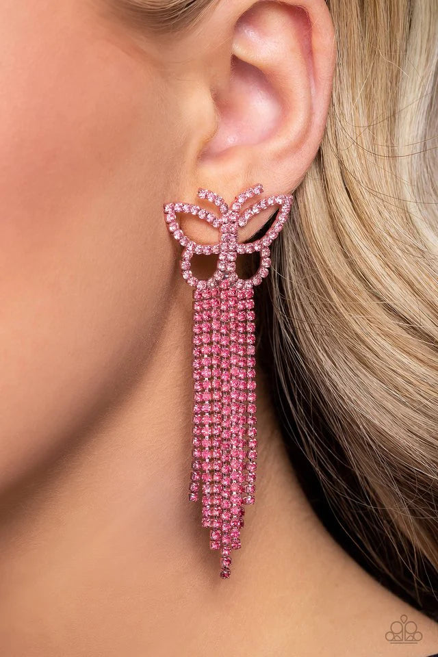 Paparazzi Accessories Billowing Butterflies - Pink Glassy pink rhinestones, encrusted along the front of a pink butterfly frame, create a whimsical centerpiece. Staggered rows of different pink rhinestones pressed in delicate silver square fittings cascad