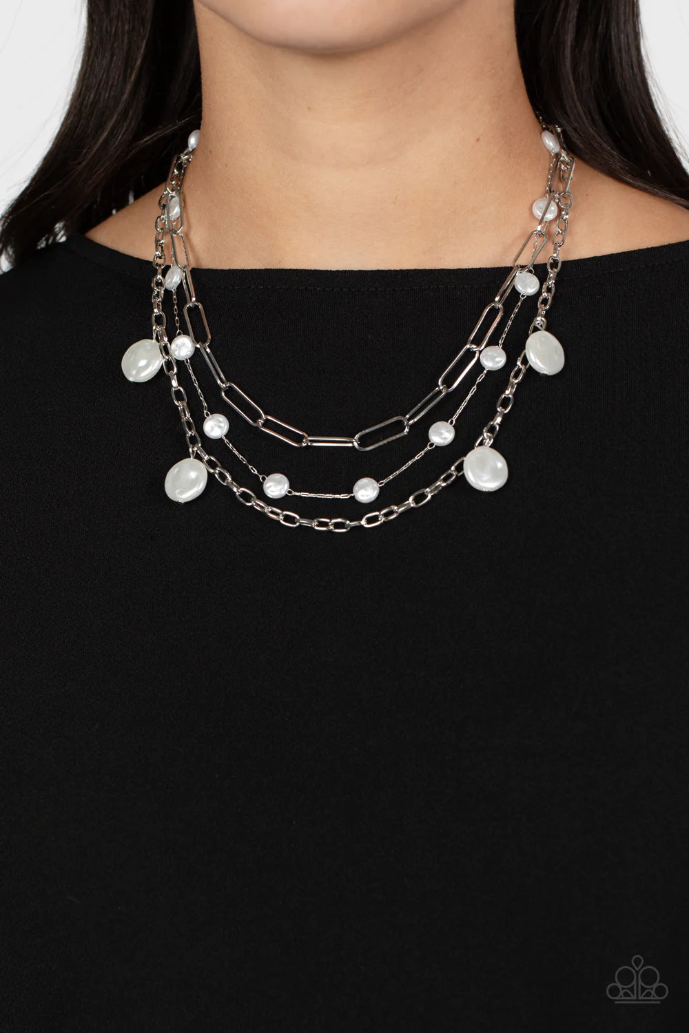 Paparazzi Accessories Blissful Ballad - White Infused with a dainty silver chain, flattened baroque pearls sporadically trickle along shimmery silver paperclip chains in varying sizes, creating refined layers down the chest. Sporadically hanging from the