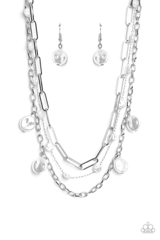 Paparazzi Accessories Blissful Ballad - White Infused with a dainty silver chain, flattened baroque pearls sporadically trickle along shimmery silver paperclip chains in varying sizes, creating refined layers down the chest. Sporadically hanging from the