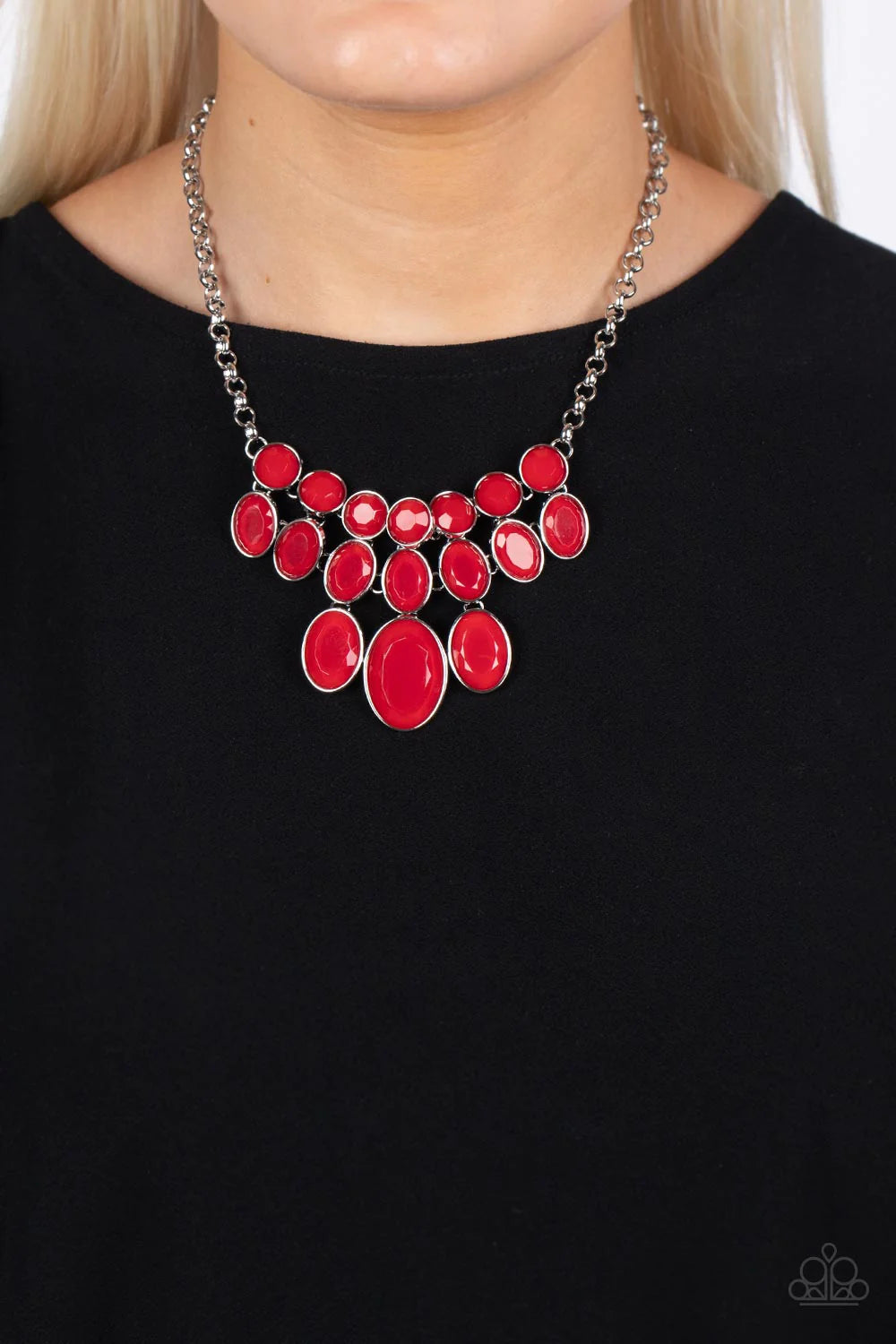 Paparazzi Accessories Delectable Daydream - Red A decadent collection of faceted red beads gradually increase in size as they fall into a tapered display. The smallest round beads anchor the design, with the rows underneath them slowly elongating into ove