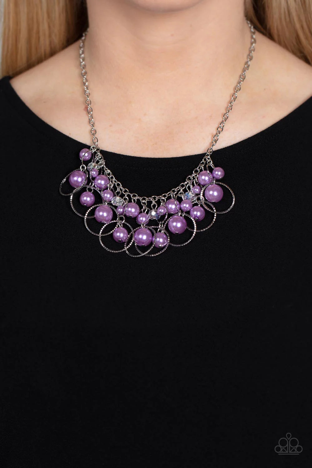 Paparazzi Accessories Ballroom Bliss - Purple Set inside of and surrounded by alternating sizes of silver rings, staggered clusters of lavender pearls and faceted clear crystal beads delicately link into a flirtatious hint of sparkle below the collar. Fea