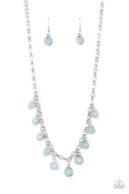 Paparazzi Accessories Moonbeam Magic - Blue Featuring a milky shimmer, opaque Spun Sugar crystal-like beads are pressed into simple silver settings as they dance below the collar for a colorfully carefree look. Features an adjustable clasp closure. Sold a