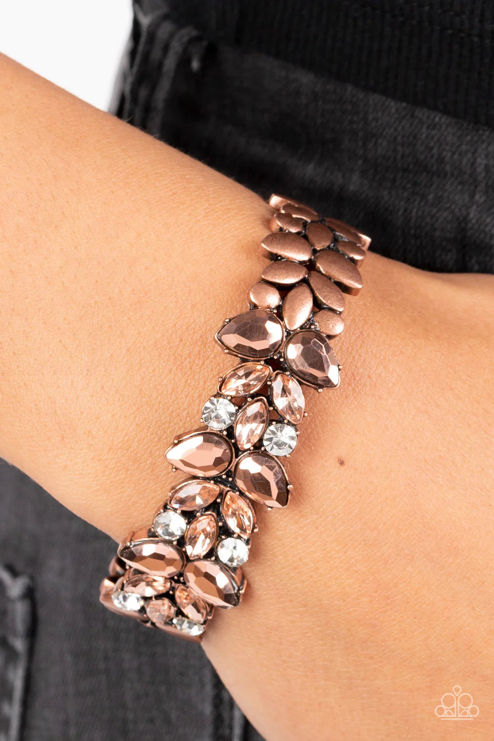 Paparazzi Accessories Glacial Gleam - Copper Coppery aurum teardrop and coppery marquise gems converge into an edgy design with a subtle floral motif across the front of a copper cuff. Glitzy white rhinestones add an air of mystery to the piece, while smo