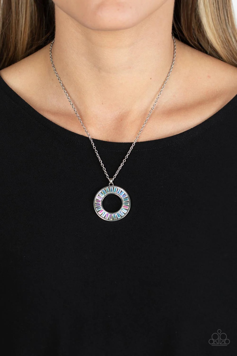 Paparazzi Accessories Clique Couture - Multi Brilliant emerald-cut rhinestones brushed in an iridescent shimmer are pressed inside a wide circular silver frame, creating a glitzy pendant at the bottom of a dainty silver chain. Features an adjustable clasp