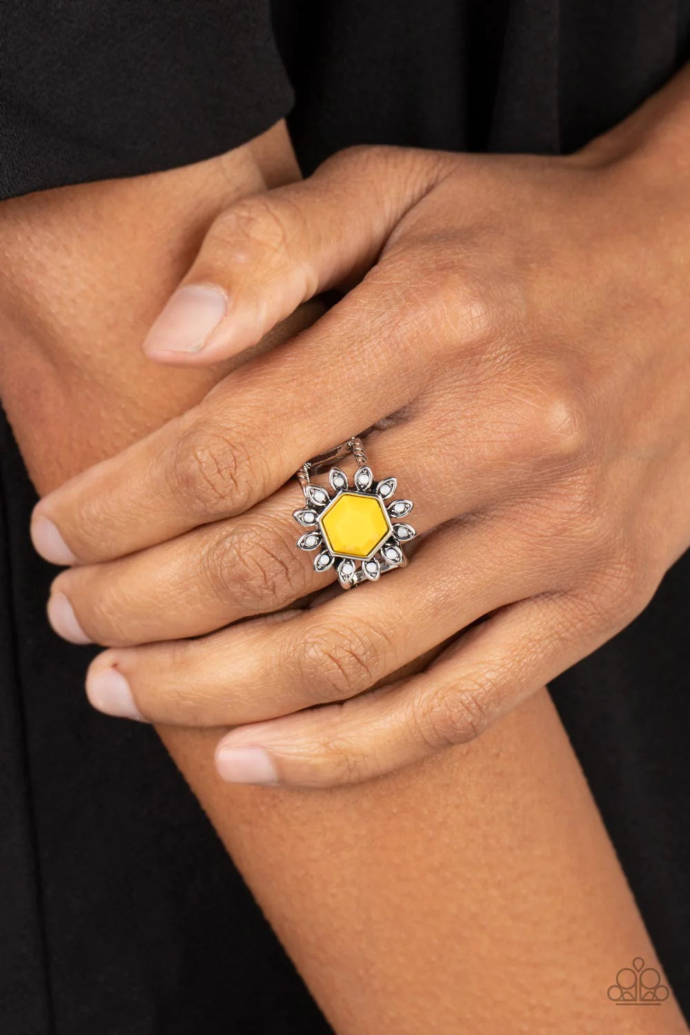 Paparazzi Accessories Wonderfully Wallflower - Yellow A hexagon-shaped Samoan Sun bead is pressed into the center of an antiqued silver frame. Dainty silver petals dotted with white opalescent centers radiate around the defaced bead creating a whimsical a