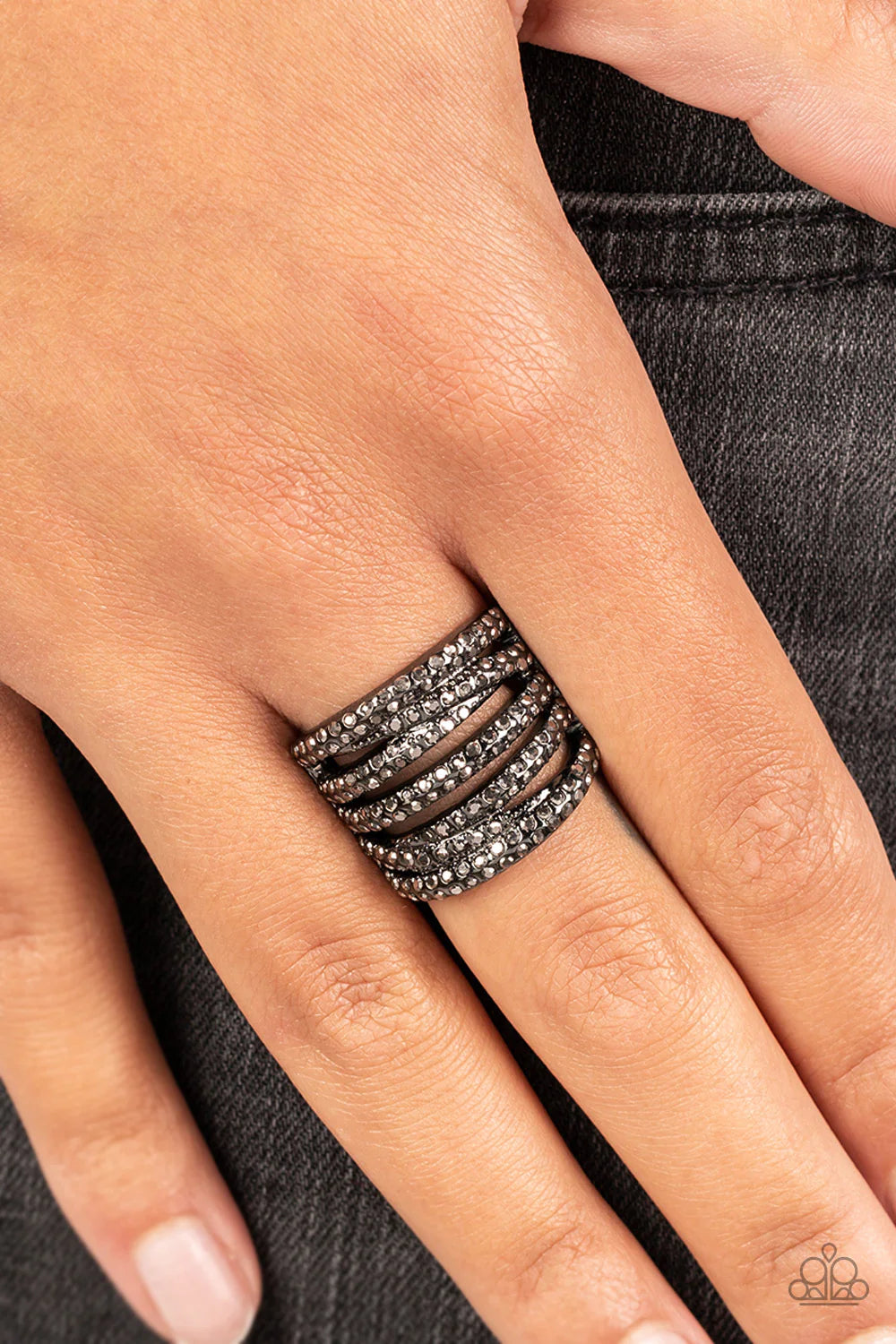 Paparazzi Accessories Knock-Out Opulence - Black Encrusted in dainty pairs of smoky hematite rhinestones, row after row of smoldering gunmetal bands stack and crisscross across the finger for a knockout look. Features a stretchy band for a flexible fit. S