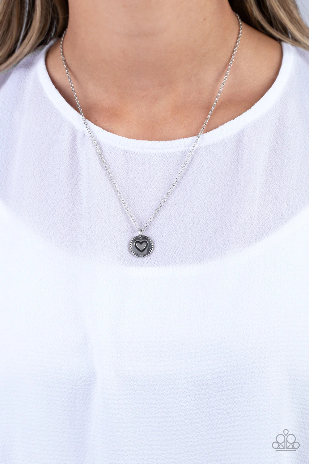 Paparazzi Accessories Stamped Sentiment - Silver Stamped in a heart burst pattern, a round silver pendant is suspended from a dainty silver chain for a sentimentally sleek design. Features an adjustable clasp closure. Sold as one individual necklace. Incl