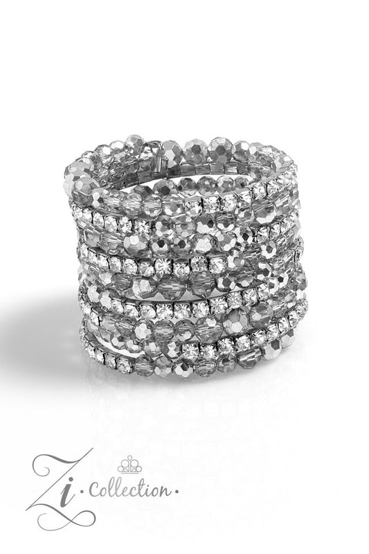 Paparazzi Accessories Ready For More - White A collection of faceted beads and sparkling white rhinestones is threaded along an invisible wire that coils around the wrist. Each flick of the wrist captures a different detail, mesmerizing onlookers with the