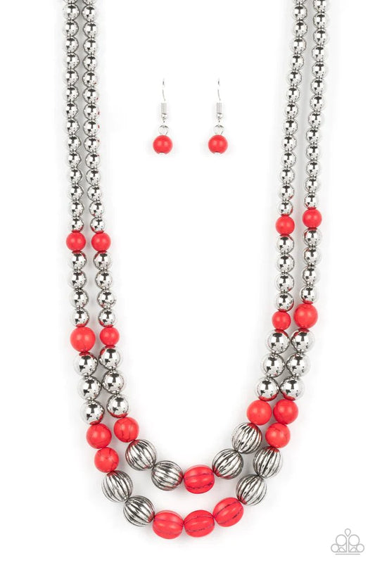 Paparazzi Accessories Country Road Trip - Red Gradually increasing in size, an earthy series of shiny silver beads, fiery red stones, and faux red stone accents are threaded along invisible wires below the collar, resulting in a rustic layered look. Featu