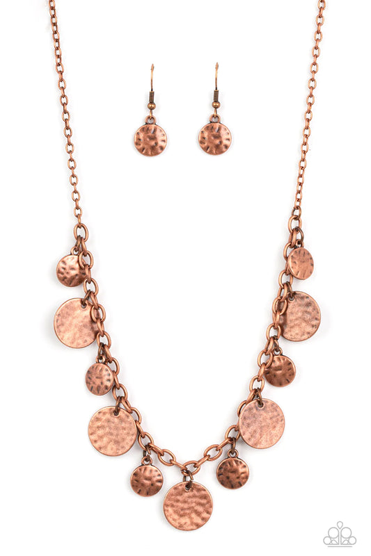 Paparazzi Accessories Model Medallions - Copper Copper discs in a variety of sizes dance along a copper chain in a charming display. The discs are hammered in texture, adding rustic, handcrafted detail to the design. Features an adjustable clasp closure.