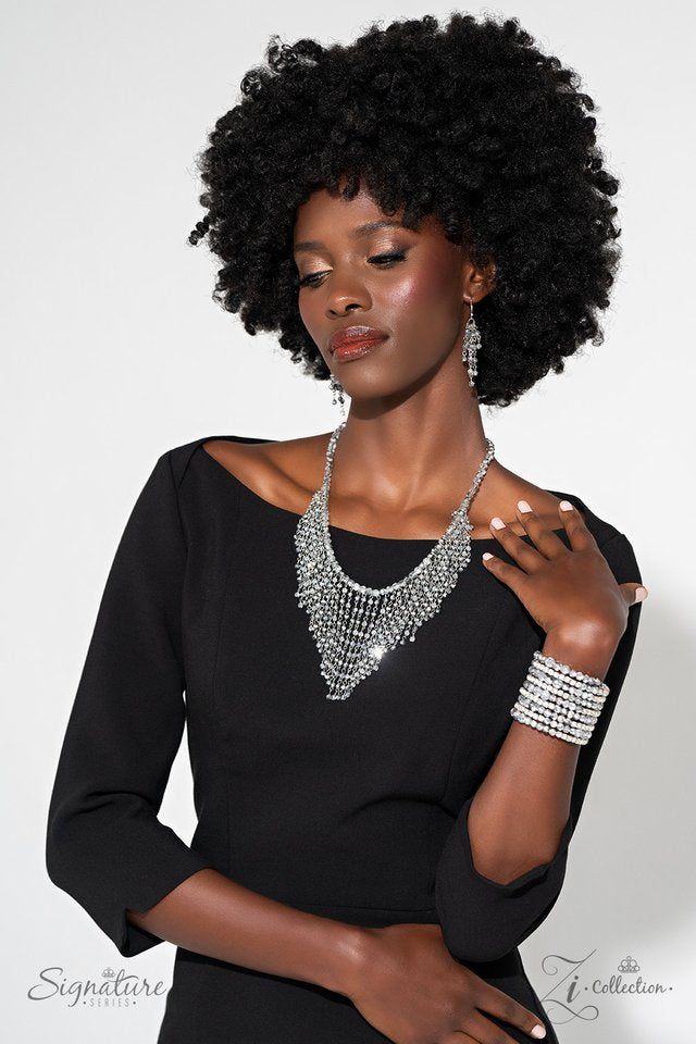 Paparazzi Accessories Ready For More - White A collection of faceted beads and sparkling white rhinestones is threaded along an invisible wire that coils around the wrist. Each flick of the wrist captures a different detail, mesmerizing onlookers with the
