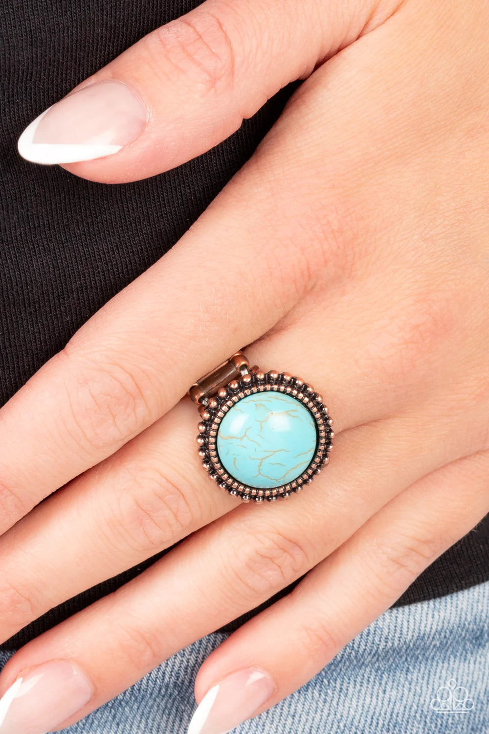 Paparazzi Accessories Mesa Mecca - Copper A round turquoise stone bursts from a dainty border of textured copper. An outer ring of rustic copper studs radiates around the design, adding an authentic flair to the artisan-inspired centerpiece. Features a st