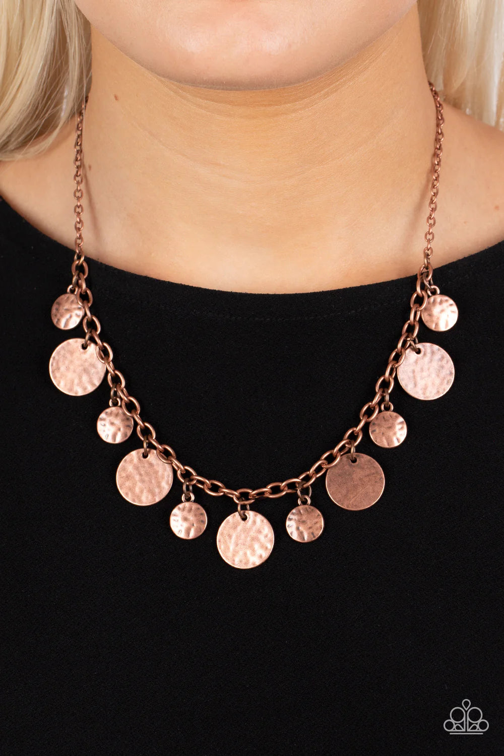 Paparazzi Accessories Model Medallions - Copper Copper discs in a variety of sizes dance along a copper chain in a charming display. The discs are hammered in texture, adding rustic, handcrafted detail to the design. Features an adjustable clasp closure.