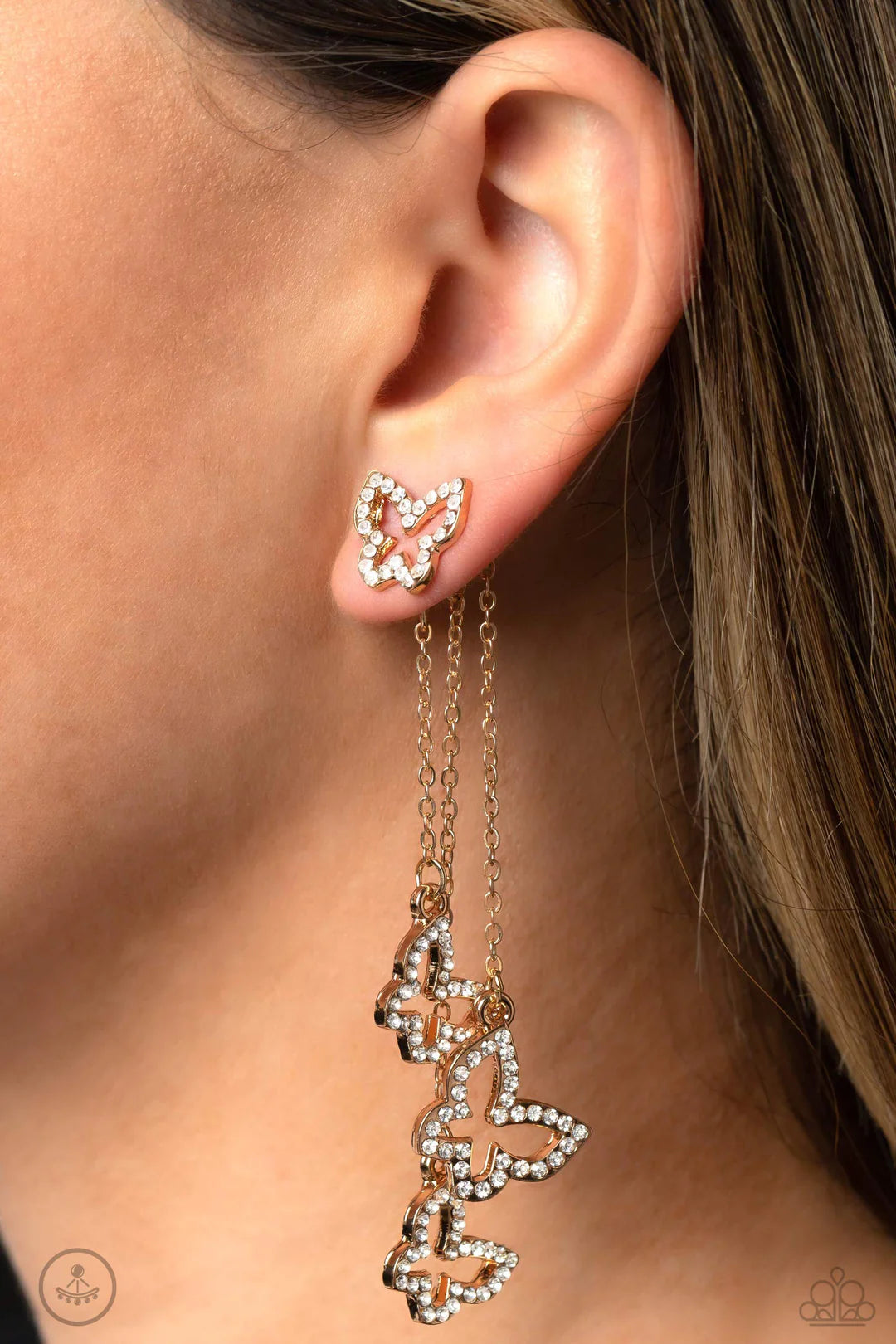 Paparazzi Accessories Boisterous Butterfly - Gold Cascading from a solitaire, rhinestone-encrusted butterfly, a trio of butterfly silhouettes in varying sizes with a similar sparkle attaches to a double-sided post as it cascades from dainty gold chains fo