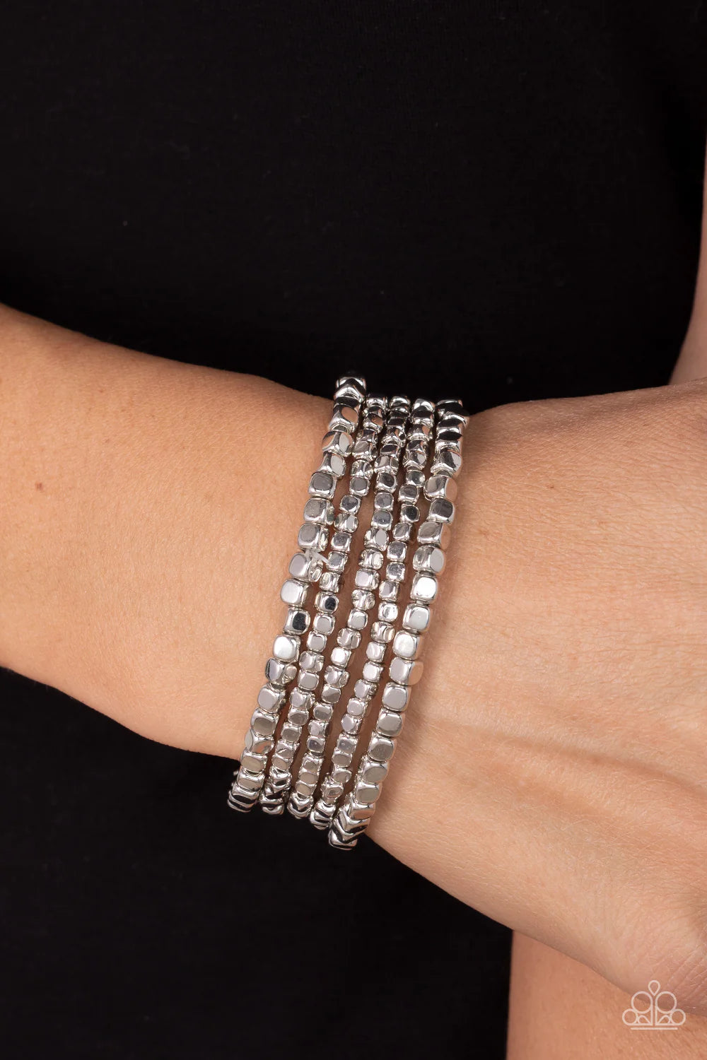 Paparazzi Accessories Right on Cube - Silver A dainty collection of shiny silver cube beads are threaded along stretchy bands around the wrist, creating edgy layers. Sold as one individual bracelet. Jewelry