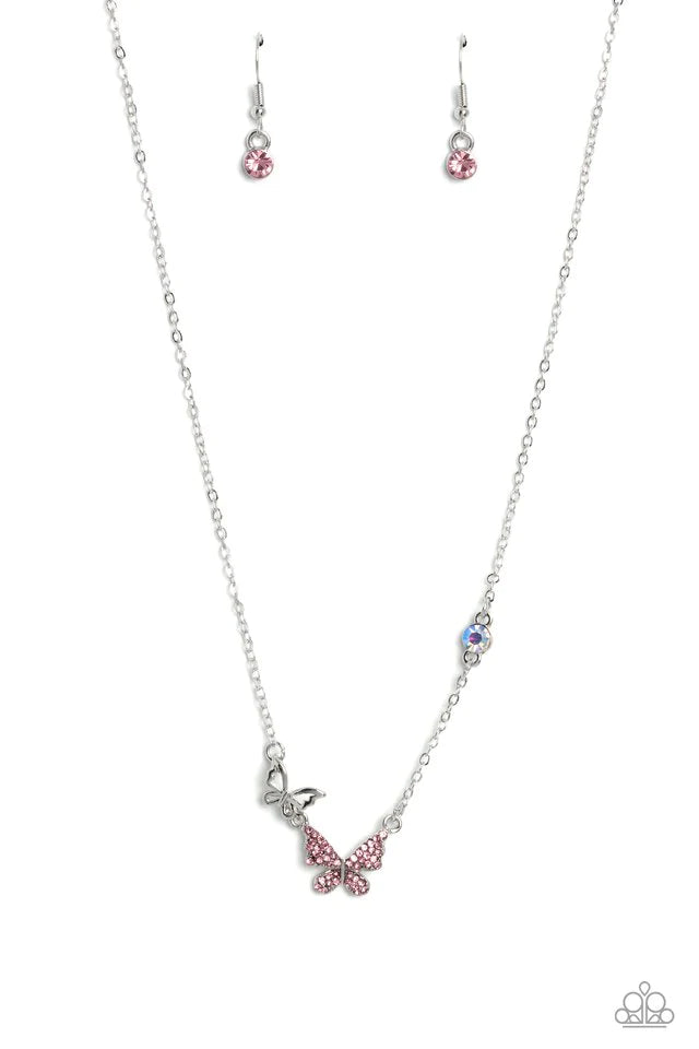 Paparazzi Accessories Can’t BUTTERFLY Me Love - Pink A silver butterfly, dotted in dainty light rose rhinestones, hangs from the bottom of a dainty silver chain. A smaller, airy silver butterfly appears to be in mid-flight as it's tilted to its side and b
