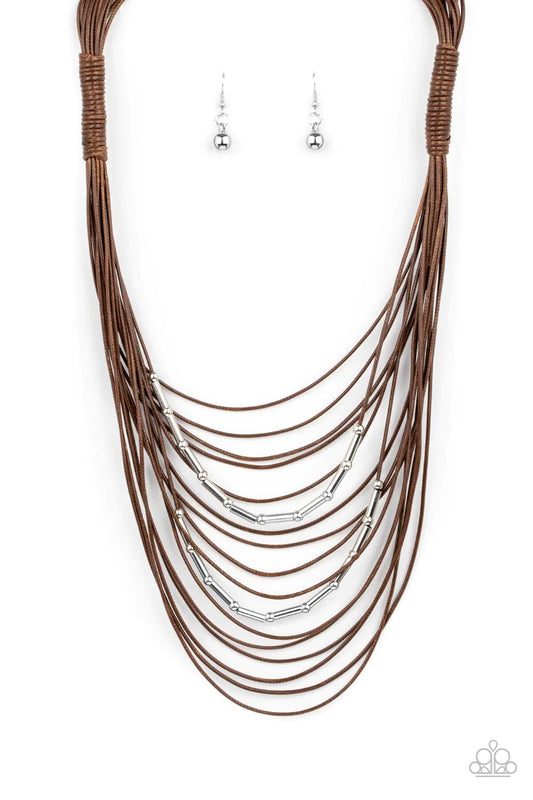 Paparazzi Accessories Nice CORD-ination - Brown Two rows of dainty silver beads and cylindrical rods are threaded along strands of shiny brown cording that has been knotted in place, creating edgy rows across the chest. Features an adjustable clasp closur