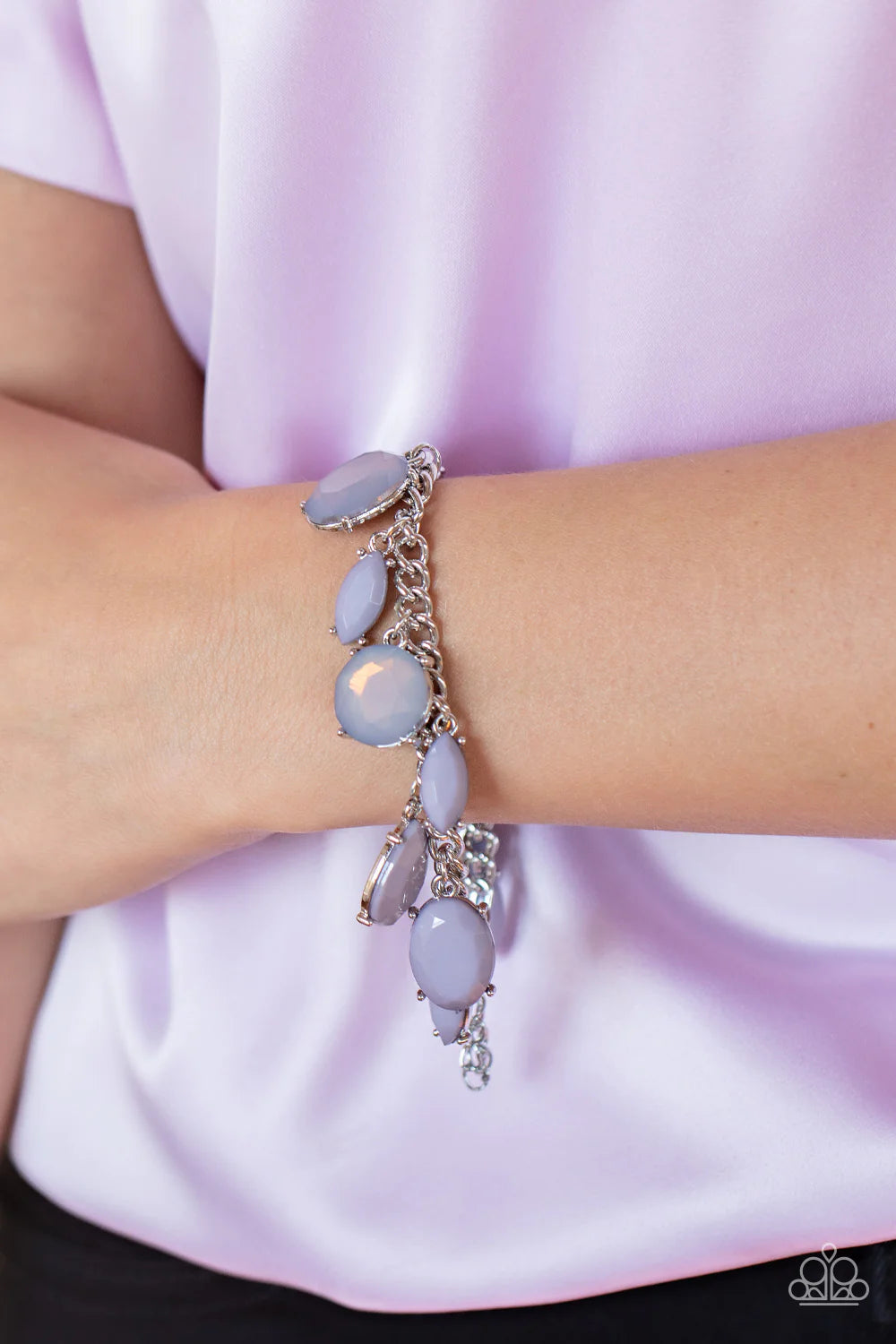 Paparazzi Accessories Serendipitous Shimmer - Silver A charming collection of opaque and translucent Gray Lilac beads swings from a classic silver chain. The faceted beads are a mishmash of shapes and sizes, creating a flirtatious pop of color around the