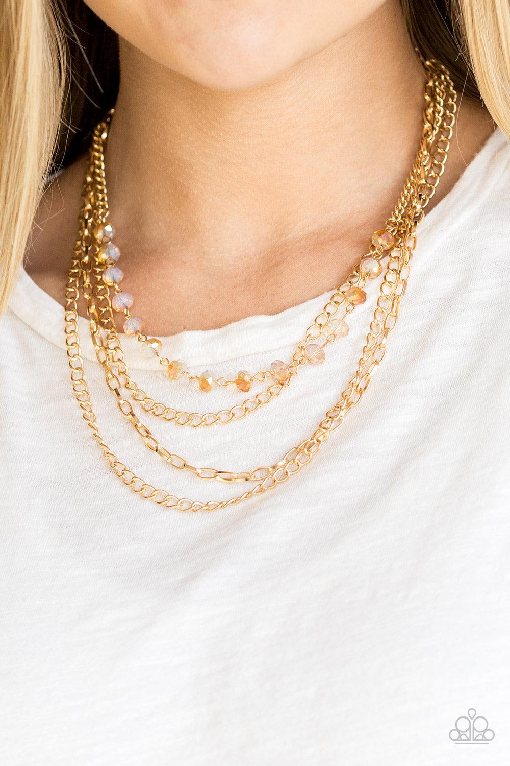 Paparazzi Accessories Extravagant Elegance - Gold Mismatched gold chains layer down the chest. A strand of gold dusted gems join below the collar for a glamorous look. Features an adjustable clasp closure. Sold as one individual necklace. Includes one pai