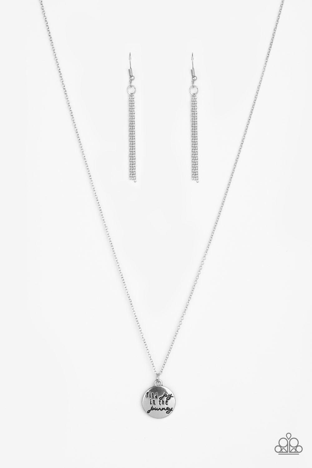 Paparazzi Accessories Find Joy - Silver Stamped in the inspirational phrase, "find joy in the journey," a round silver pendant swings below the collar for a seasonal look. Features an adjustable clasp closure. Sold as one individual necklace. Includes one