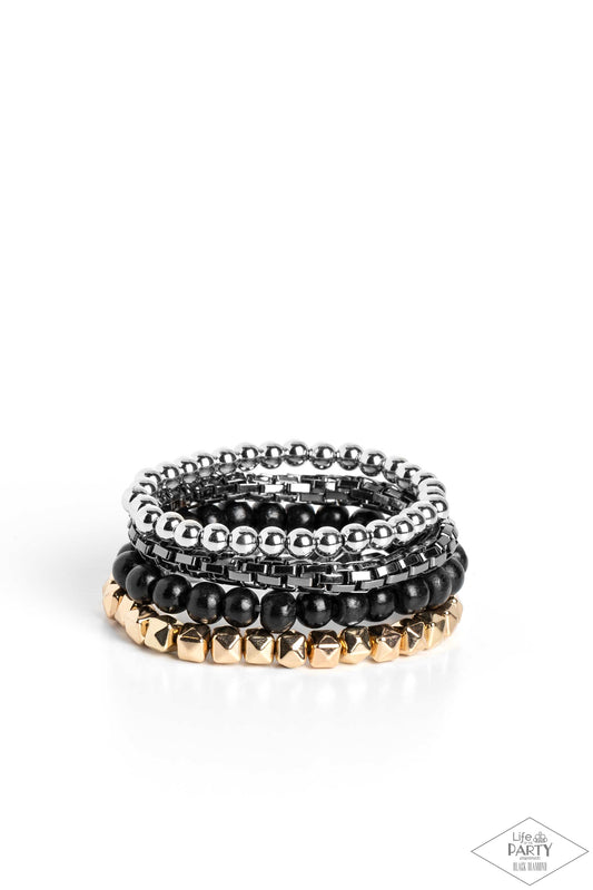 Paparazzi Accessories Retro Rocker - Multi A rock star mashup of gold, gunmetal, and silver beads collides with earthy wooden black beads that are threaded along stretchy bands, creating retro layers across the wrist. Sold as one set of four bracelets. Je