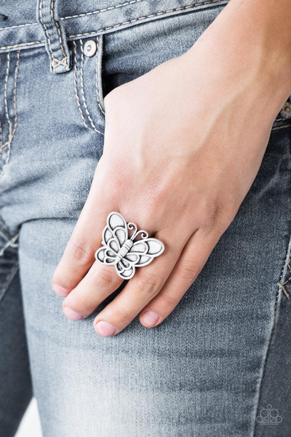 Paparazzi Accessories Sky High Butterfly - Silver Brushed in an antiqued finish, a dramatic silver butterfly blooms across the finger for a whimsical look. Features a stretchy band for a flexible fit. Sold as one individual ring. Jewelry