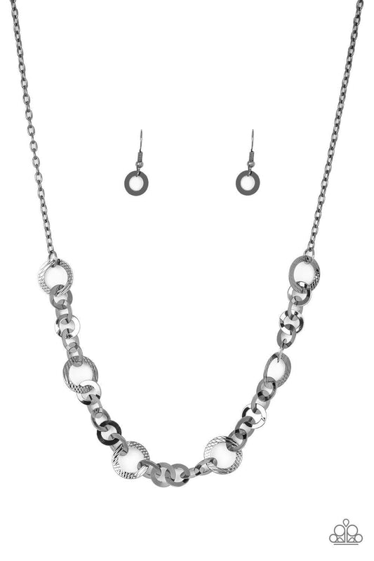 Paparazzi Accessories Move It On Over - Black Smooth and textured gunmetal hoops connect below the collar for a modern industrial look. Features an adjustable clasp closure. Sold as one individual necklace. Includes one pair of matching earrings. Get The