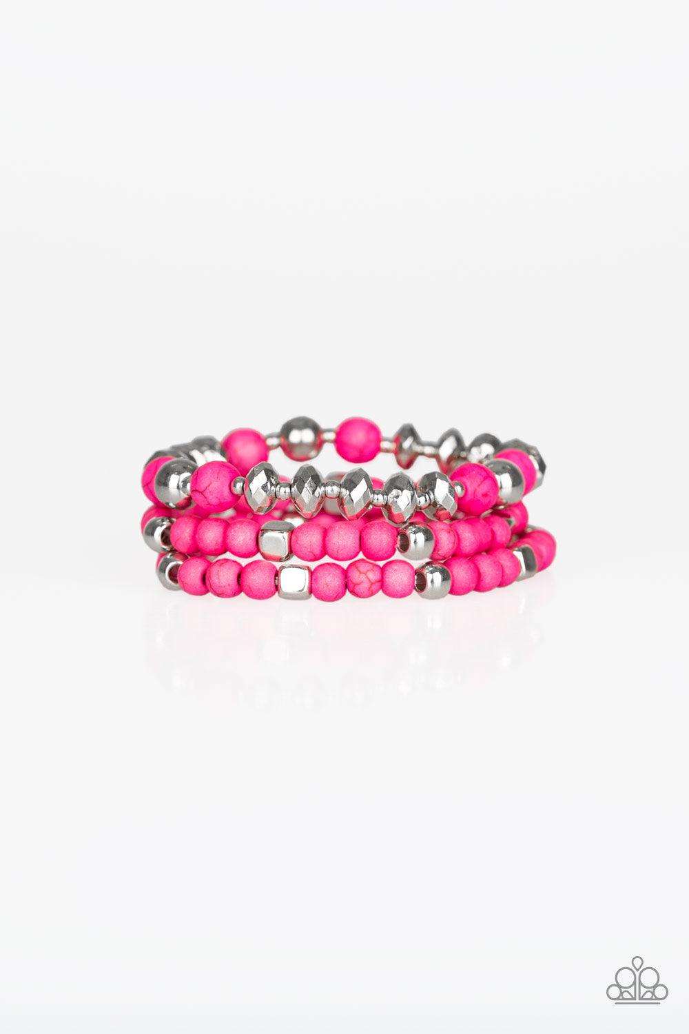 Paparazzi Accessories Mountain Artist - Pink A collection of vivacious pink stones, faceted pink beads, and shimmery silver accents are threaded along stretchy bands, creating colorful layers around the wrist. Sold as one set of three bracelets. Jewelry