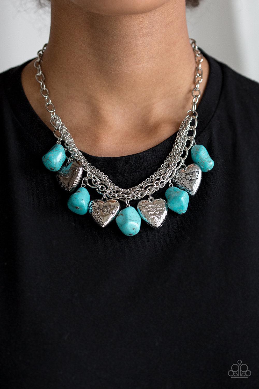 Paparazzi Accessories Change Of Heart - Blue Faux turquoise rocks alternate with heart charms along a chunky silver chain. Hearts are inscribed with the phrase "With All My Heart" on one side and a short bible verse on the other that reads, "Love the Lord