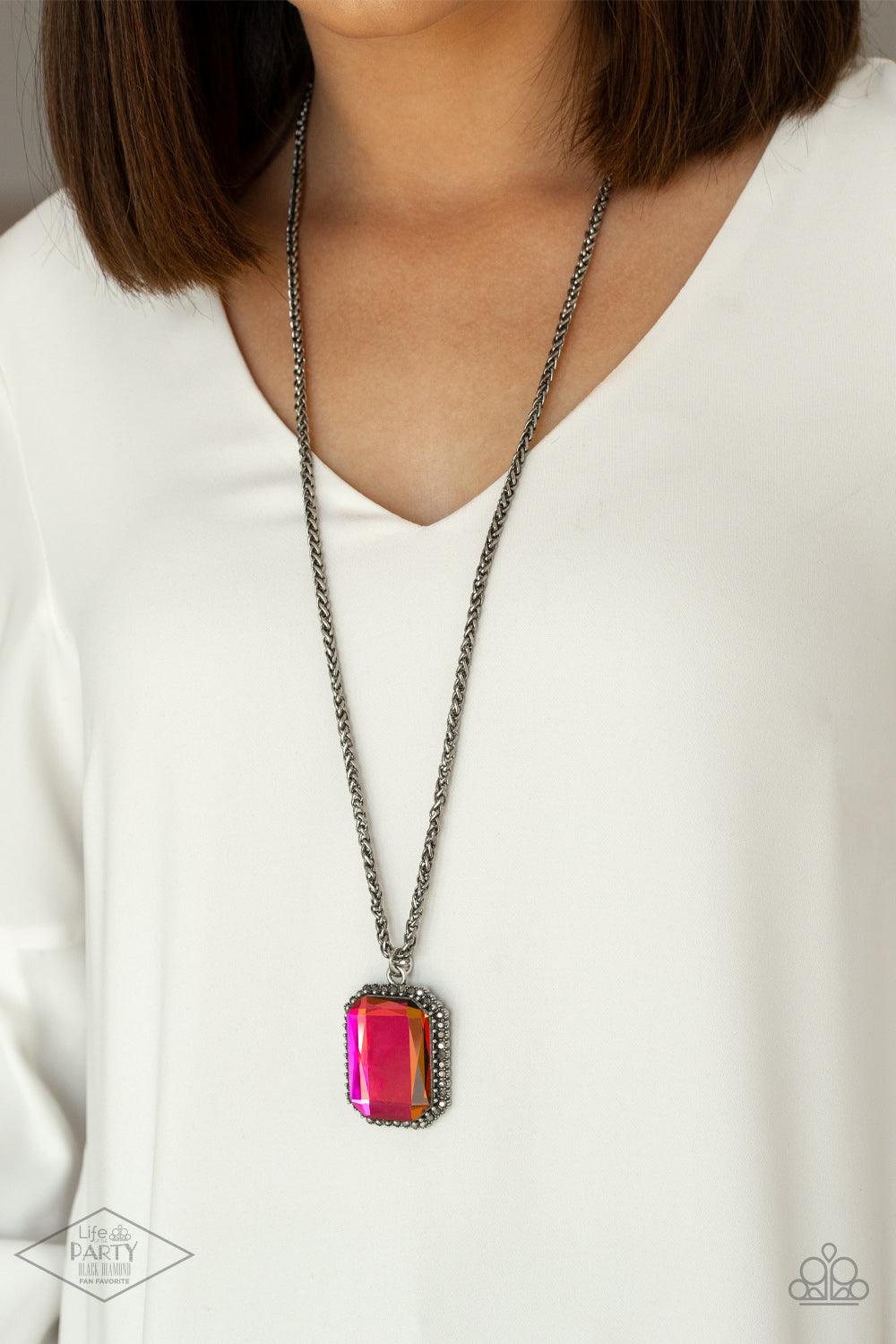 Paparazzi Accessories Let Your HEIR Down - Multi Bordered in dainty hematite rhinestones, an oversized faceted oil spill emerald style gem swings from the bottom of an antiqued silver wheat chain for a blinding look. Features an adjustable clasp closure.