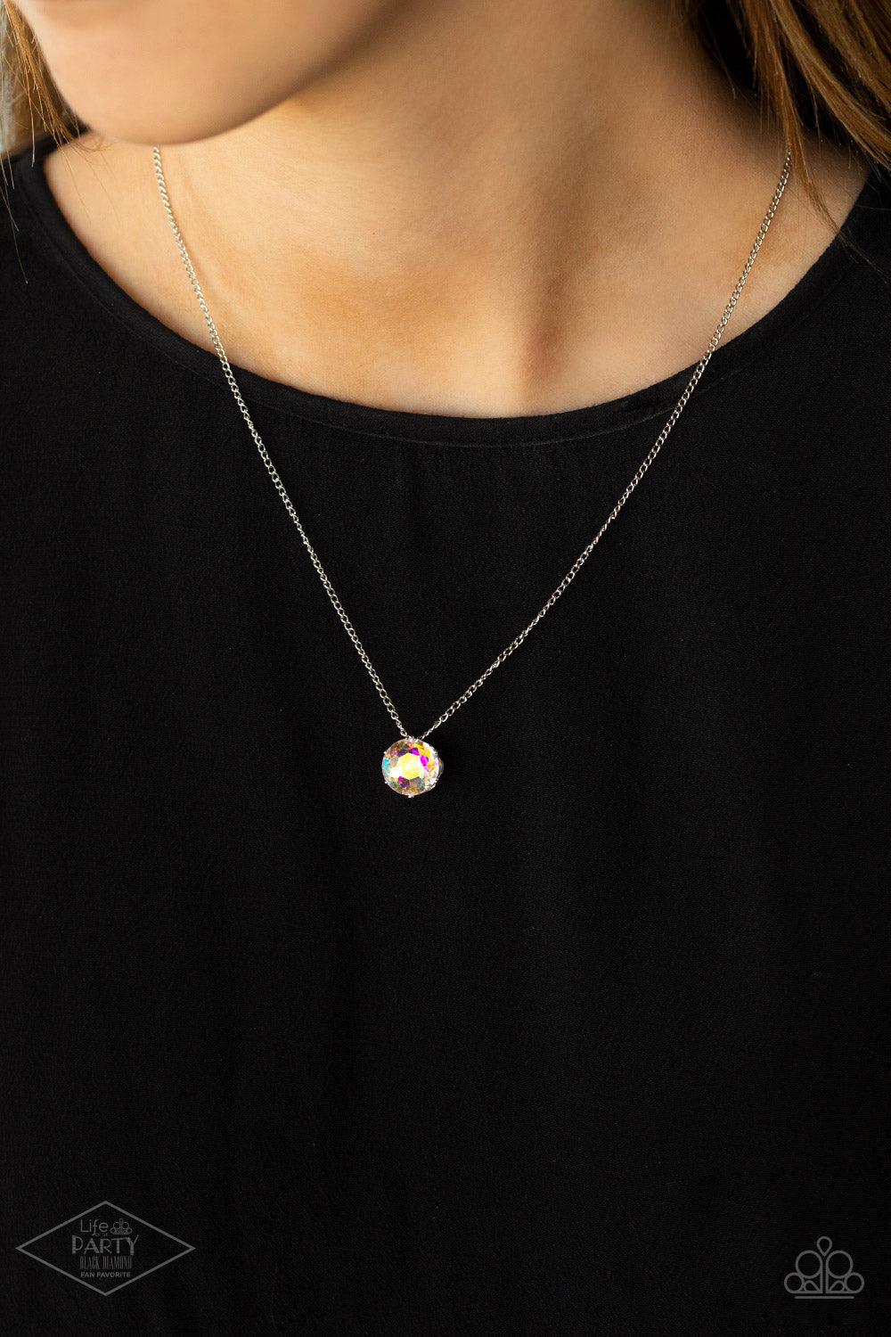 Paparazzi Accessories What A Gem - Multi A single iridescent rhinestone sparkles brilliantly at the bottom of a dainty silver chain, creating a stunning solitaire design. Features an adjustable clasp closure. Sold as one individual necklace. Includes one