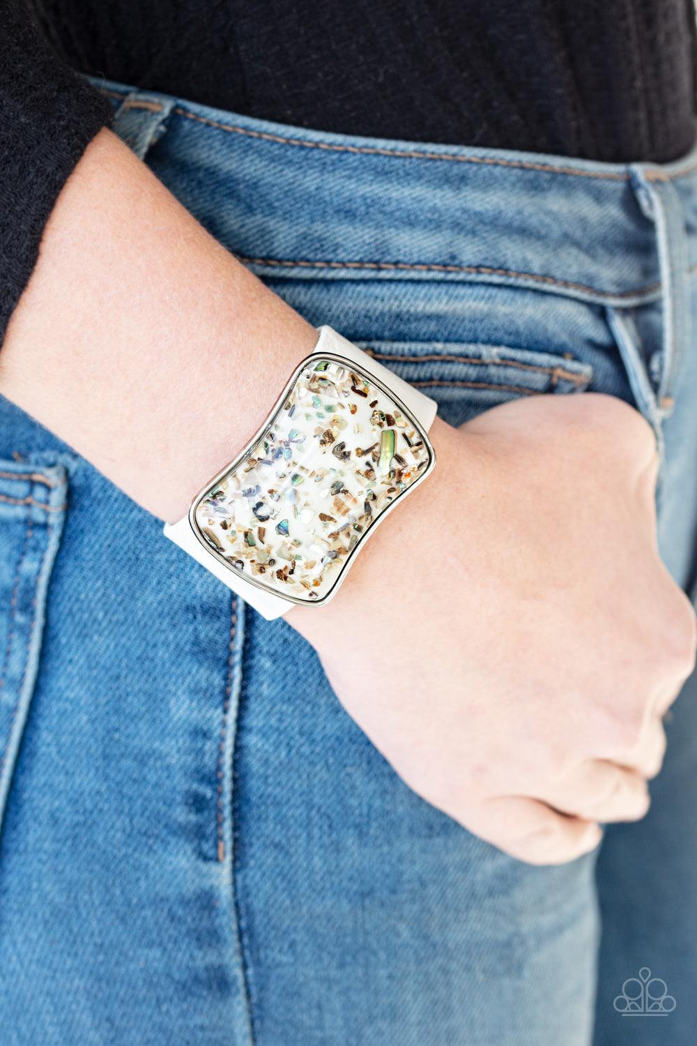 Paparazzi Accessories Twinkle Twinkle Little ROCK STAR - White Flecks of iridescent rocks are in a glass-like frame that slides along a shiny white leather band, creating a shimmery centerpiece atop the wrist. Features an adjustable snap closure. Sold as