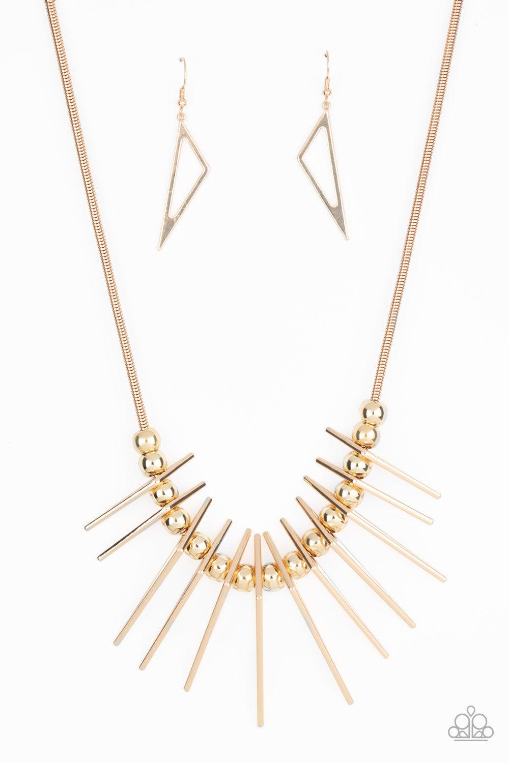 Paparazzi Accessories Fully Charged - Gold Separated by bold gold beads, triangular gold frames gradually increase in intensity as they slide along a rounded gold snake chain, creating an edgy fringe below the collar. Features an adjustable clasp closure.