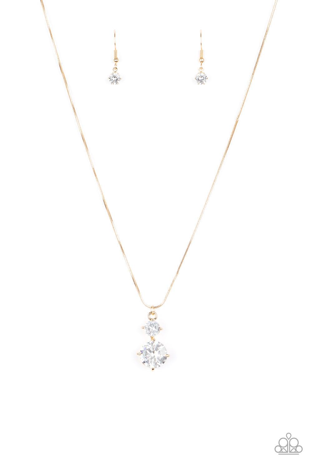 Paparazzi Accessories Top Dollar Diva - Gold Nestled inside classic gold prongs, two oversized white rhinestones slide along a dainty gold snake chain, creating a dramatic pendant below the collar. Features an adjustable clasp closure. Sold as one individ