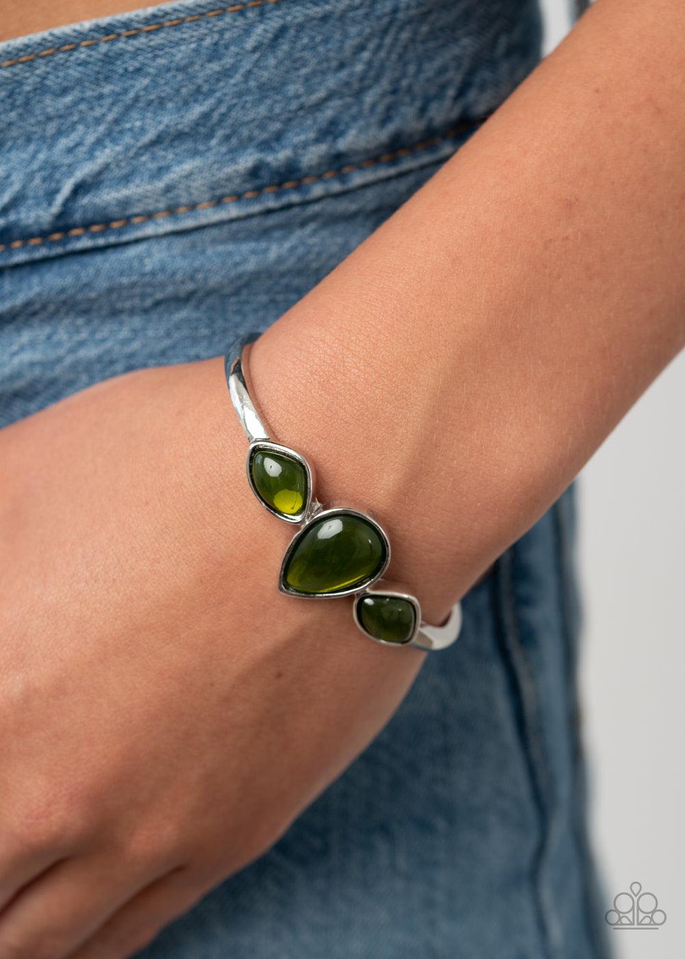 Paparazzi Accessories Boho Beach Babe - Green Oversized glassy green stones are encrusted across the center of a dainty silver cuff, creating a colorful centerpiece. Sold as one individual bracelet. Jewelry