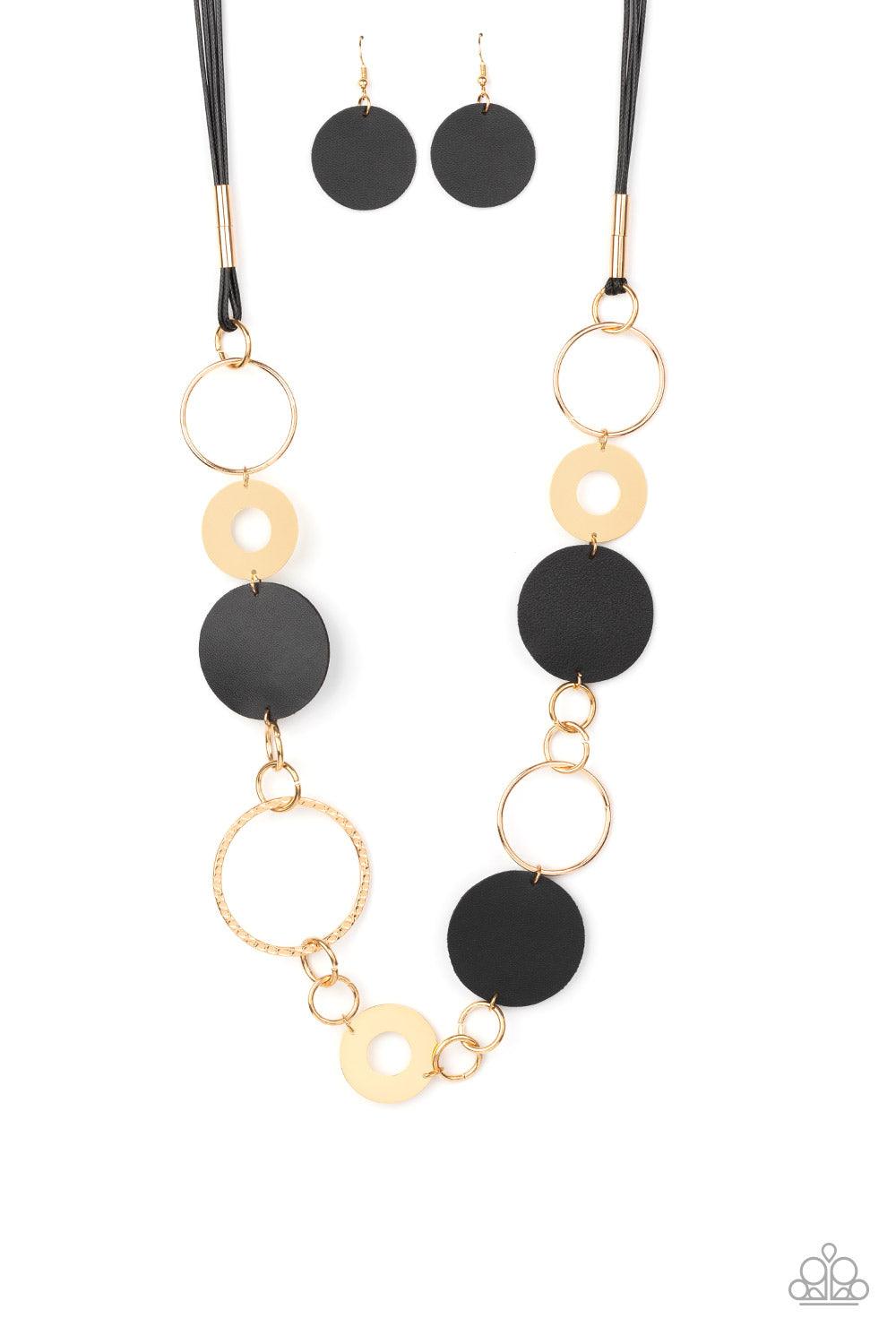Paparazzi Accessories Sooner or LEATHER - Black A shiny collection of mismatched gold rings and textured hoops link with round pieces of black leather across the chest for a whimsically retro look. The colorful compilation attaches to layered strands of s