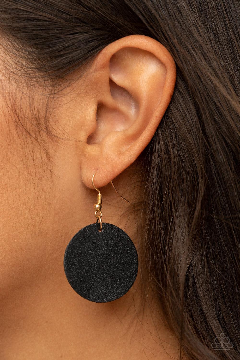Paparazzi Accessories Sooner or LEATHER - Black A shiny collection of mismatched gold rings and textured hoops link with round pieces of black leather across the chest for a whimsically retro look. The colorful compilation attaches to layered strands of s