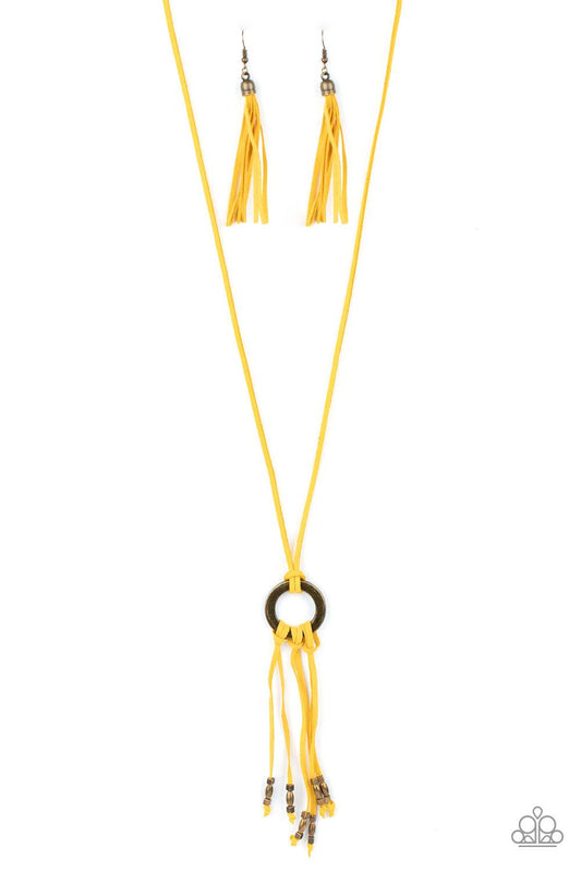 Paparazzi Accessories Feel at HOMESPUN - Yellow Infused with dainty brass beads, strands of yellow suede knot at the bottom of an antiqued brass ring, creating a colorfully rustic tassel at the bottom of a lengthened strand of yellow suede. Features an ad