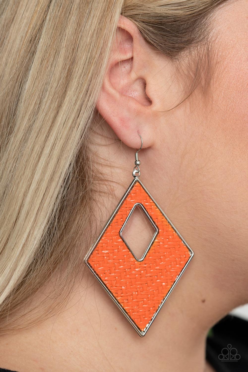 Paparazzi Accessories Woven Wanderer - Orange Featuring a wicker-like pattern, shiny Amberglow thread weaves across the front of a silver diamond-shape frame for a trendsetting look. Earring attaches to a standard fishhook fitting. Sold as one pair of ear