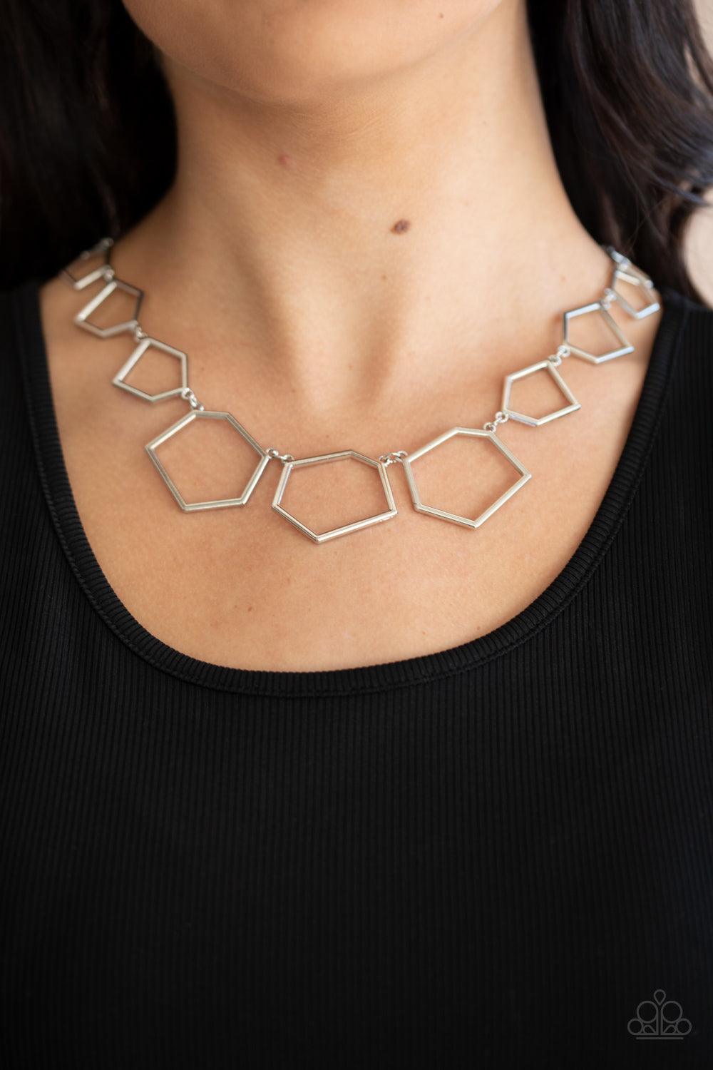 Paparazzi Accessories Full Frame Fashion - Silver An airy collection of hexagonal silver frames delicately increase in size as they link below the collar, creating a bold geometric display. Features an adjustable clasp closure. Sold as one individual neck