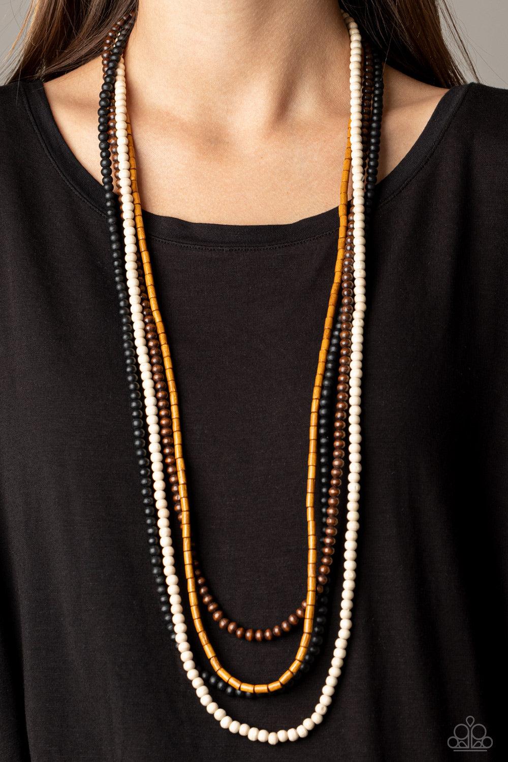 Paparazzi Accessories Bermuda Beaches - Multi Featuring round and cylindrical shapes, mismatched strands of black, brown, tan, and white wooden beads drape across the chest for a summery look. Features an adjustable clasp closure. Sold as one individual n