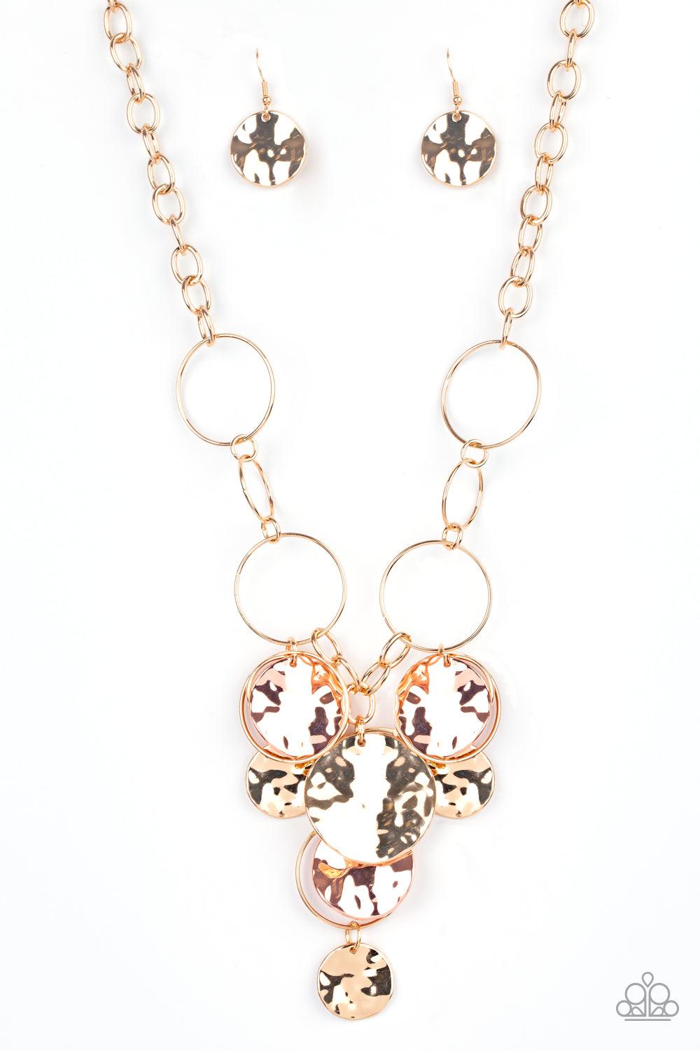 Paparazzi Accessories Learn The HARDWARE Way - Gold Glistening gold hoops link with a section of chunky gold chain below the collar. A shimmery collection of gold hoops and hammered gold and shiny copper discs cascade from the bottom of the golden display