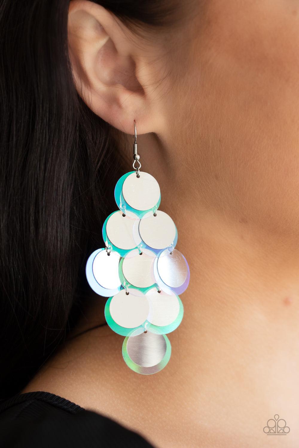 Paparazzi Accessories Sequin Seeker - Silver A bubbly collection of oversized silver and iridescent sequins cascade from the ear, creating a flirty holographic fringe. Earring attaches to a standard fishhook fitting. Sold as one pair of earrings. Jewelry