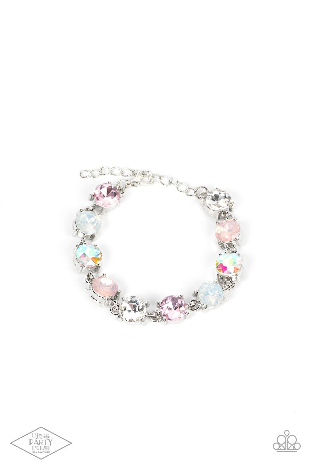 Paparazzi Accessories Celestial Couture - Pink An oversized collection of icy, pink, white, and iridescent rhinestones delicately link around the wrist for a stellar shimmer. Features an adjustable clasp closure. Sold as one individual bracelet. Bracelets