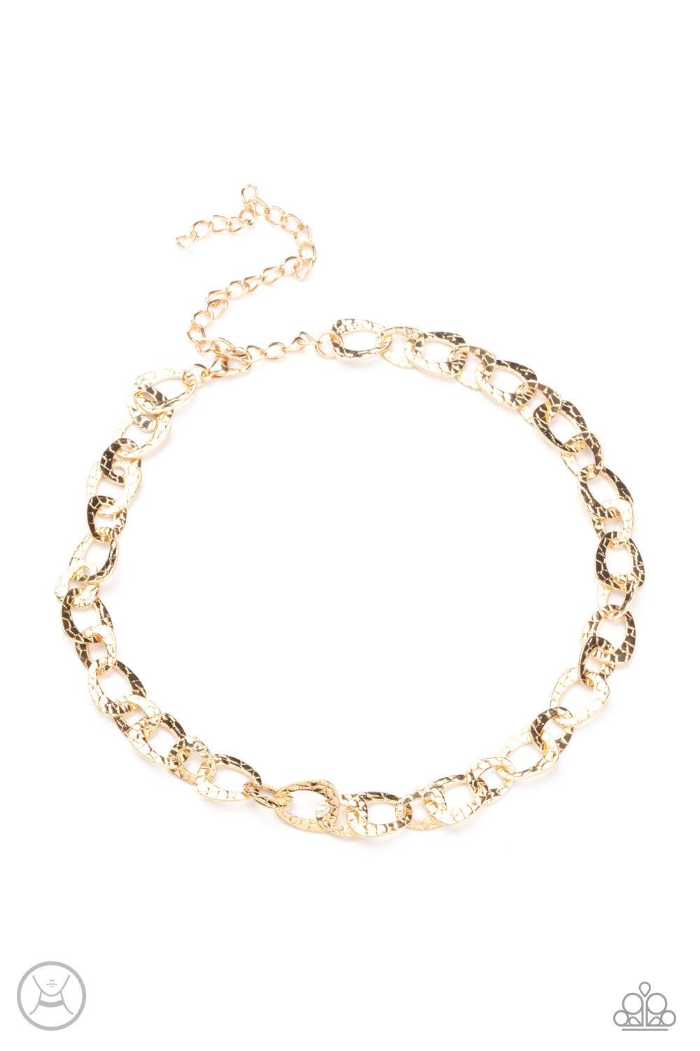 Paparazzi Accessories Urban Safari - Gold Embossed in a metallic crocodile-like print, asymmetrical gold links delicately connect around the neck for a wild industrial inspired look. Features an adjustable clasp closure. Sold as one individual choker neck